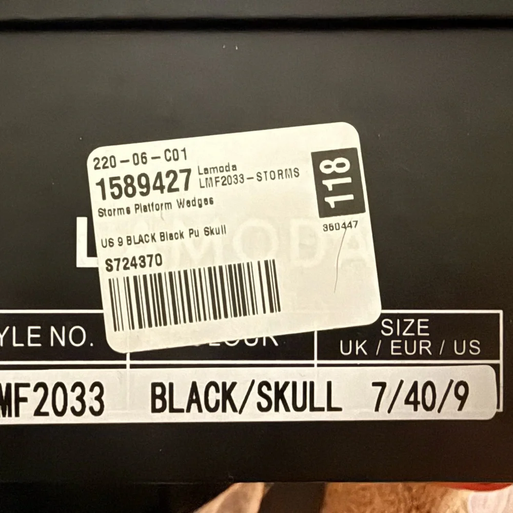 Edgy Black and White Platform Boots with Skull Motif